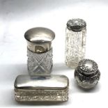 selection of antique silver top bottles and jars