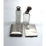 2 antique silver top scent bottles and 2 silver match book cases