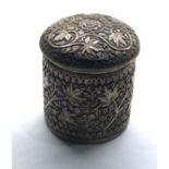 Asian silver lidded trinket pot highly decorated with floral design measures approx 65mm dia