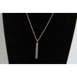 Vintage sterling silver tooth pick charm pendant on a long silver chain