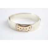 Chic sterling silver and rose gold comedy and tragedy bangle