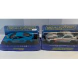 4 Scalextric boxed scalextric club includes Subaru , Aston Martin , Mercedes and Mclaren all in as