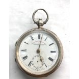 Antique large open faced silver pocket watch watch ticks when shaken back cover damaged and strained
