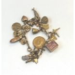 Gold charm bracelet with gold half sovereign total weight 31g