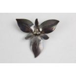 Modernist trillium floral silver brooch by Canadian silversmith Bob Ford