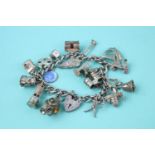 1960s heart padlock loaded sterling silver charm bracelet (79g)