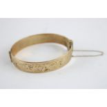 Vintage rolled gold bangle w/ scrolling foliate design