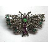 Diamond emerald and ruby set butterfly brooch set in silver and gold backed measures approx 41mm