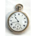 Gold plated open face pocket watch the watch winds and ticks but no warranty given case measures