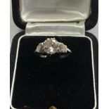 Fine 1.25ct diamond ring central diamond measures approx 7.5mm dia with baguette diamods either side