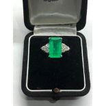 Platinum Emerald and diamond ring large central emerald measures approx 15mm by 8.5mm set with