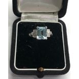 Aquamarine and diamond ring set with large central aquamarine that measures approx 9.5mm by 7.5mm