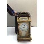 Antique brass carriage clock original box and key clock winds and ticks