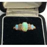 Antique 18ct diamond and opal ring central opal measures approx 8.5mm by 6mm marked 1922 and 18ct