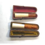 2 antique amber stem cheroot holders in original boxes they measure approx 8.5cm and 7.5cm
