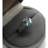 platinum aquamarine and diamond ring set with central aquamarine measures approx 9mm by 7mm with 3