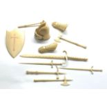 19th / 20th century Miniature carved ivory or bone knights helmet gloves sheild and weapons