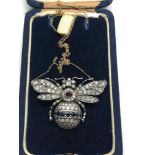 large diamond butterfly pendant on gold chain the buterfly is set with diamonds all over with