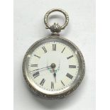victorian silver Fob watch winds and ticks but no warranty given