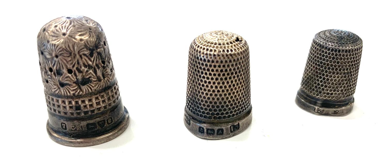 3 Silver thimbles