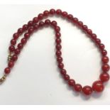 Antique round cherry amber / bakelite bead necklace graduated round beads largest measures approx