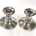 Pair silver hallmarked candle sticks, approximate height: 8cm.