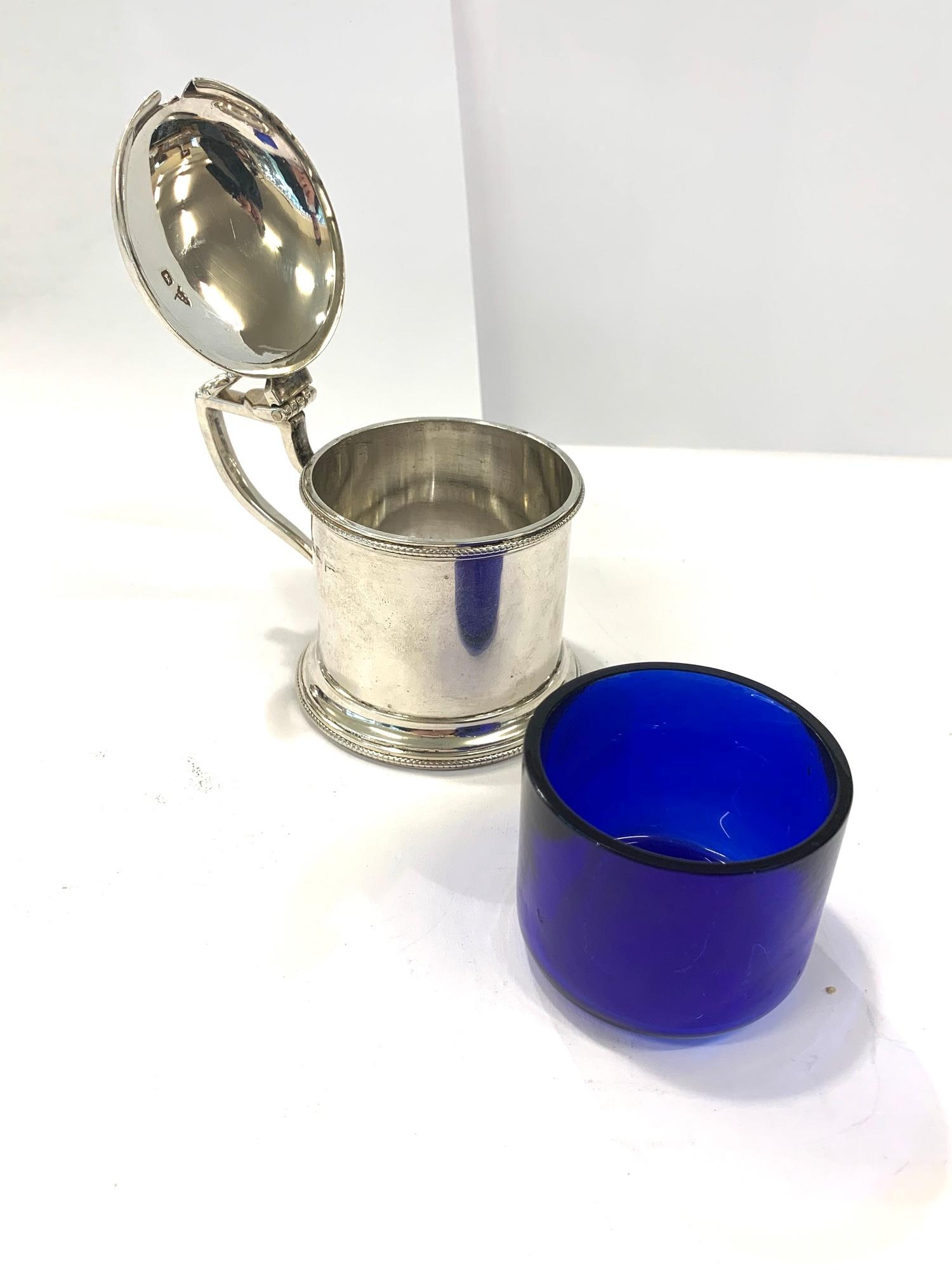 Silver hallmarked mustard pot by Walker and Hall, blue glass liner in good condition, overall