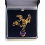 9ct Gold and Amethyst set pendant with gold chain Amethyst stone measures approx 17mm by 12mm set on
