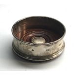 small silver wine coaster measures approx 9.3cm dia