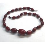 Cherry amber bakelite bead necklace good internal streaking measures approx 38cm long largest bead