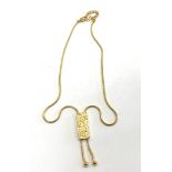 Vintage Christian Dior Gold Trotter Lariat Necklace 1980s, featuring lustrous gold plated metal,