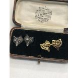 Pair of diamond fox head cufflinks, gold back, silver front, set with rose diamonds, with ruby eyes