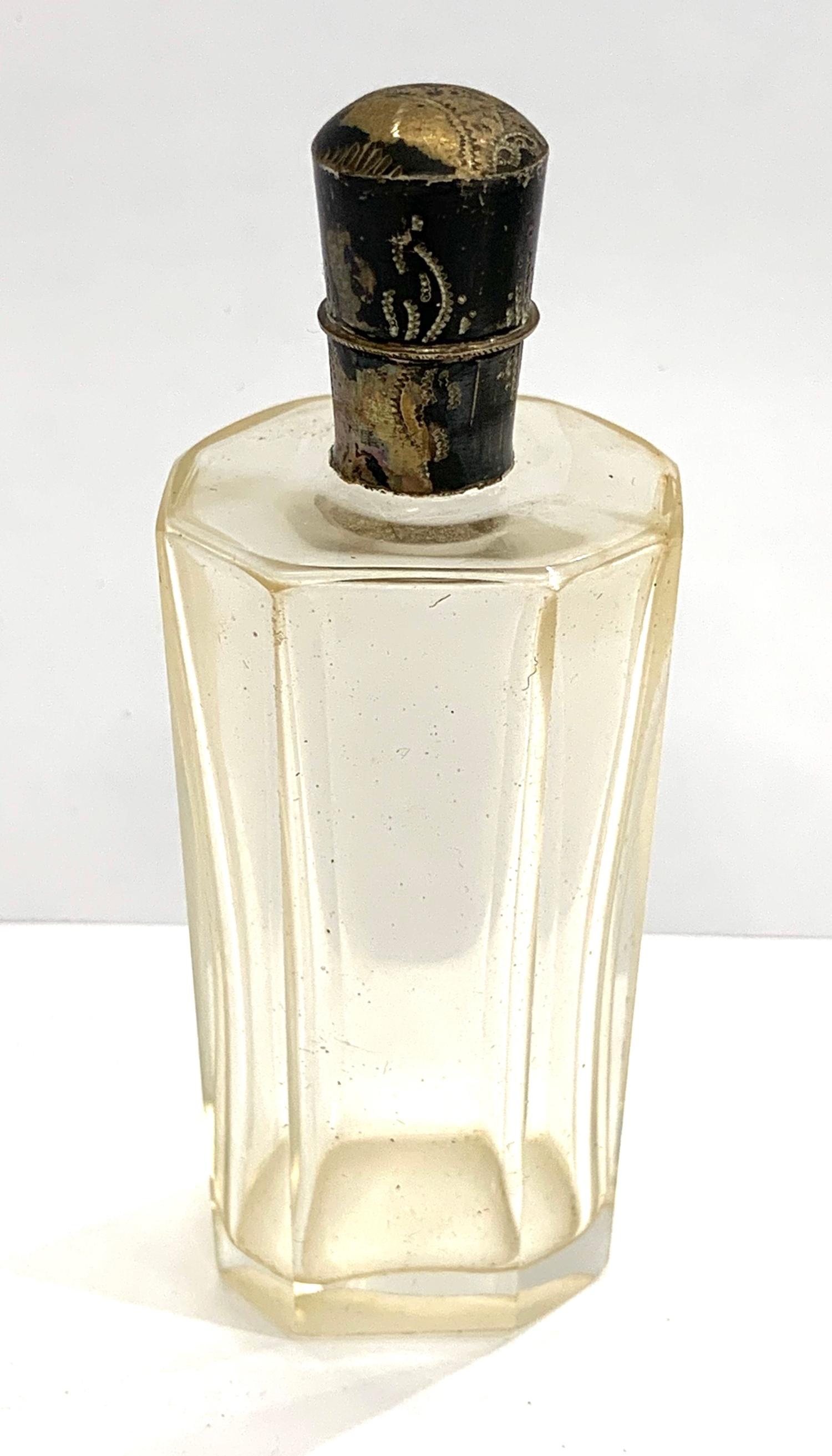 Antique silver top scent perfume bottle in good original condition small sword silver hallmark to