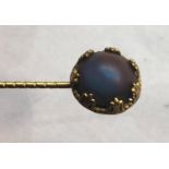 Antique saphiret stick pin stone measures approx 12mm dia set in a yellow metal stick pin measures