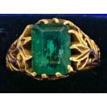 High carat gold with large emerald centre stone, emerald measures approximately 10mm by 7mm, no