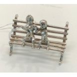 Dutch silver miniature children sitting on park bench dutch sword silver hallmarks good condition