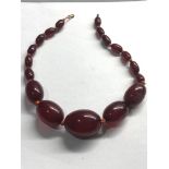 Cherry amber bakelite part bead necklace good internal streaking measures approx 32cm long largest