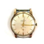 9ct gold gents accurist wristwatch, watch winds and ticks, no strap