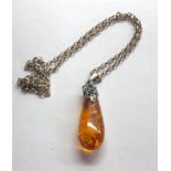 Amber pendant on silver chain