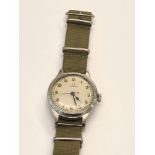 Military omega wristwatch watch winds and ticks but no warranty given please see images