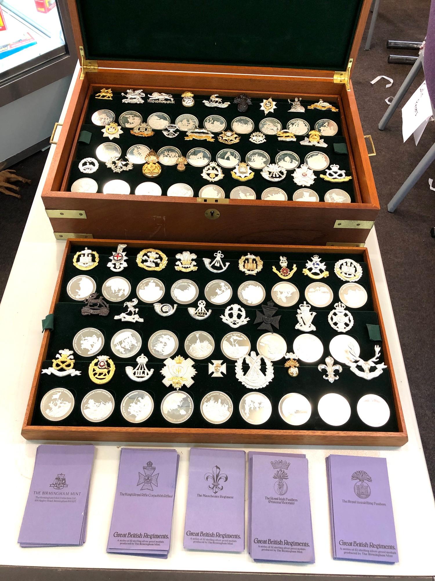 Boxed set of limited edition solid silver medals with insignia 52 solid silver medals each weigh app