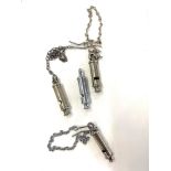 Selection of 5 vintage whistles on chains metropolitan , hudson military 974-7001 ,and hudson