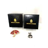 2 boxed Butler & Wilson brooches a panda and fan