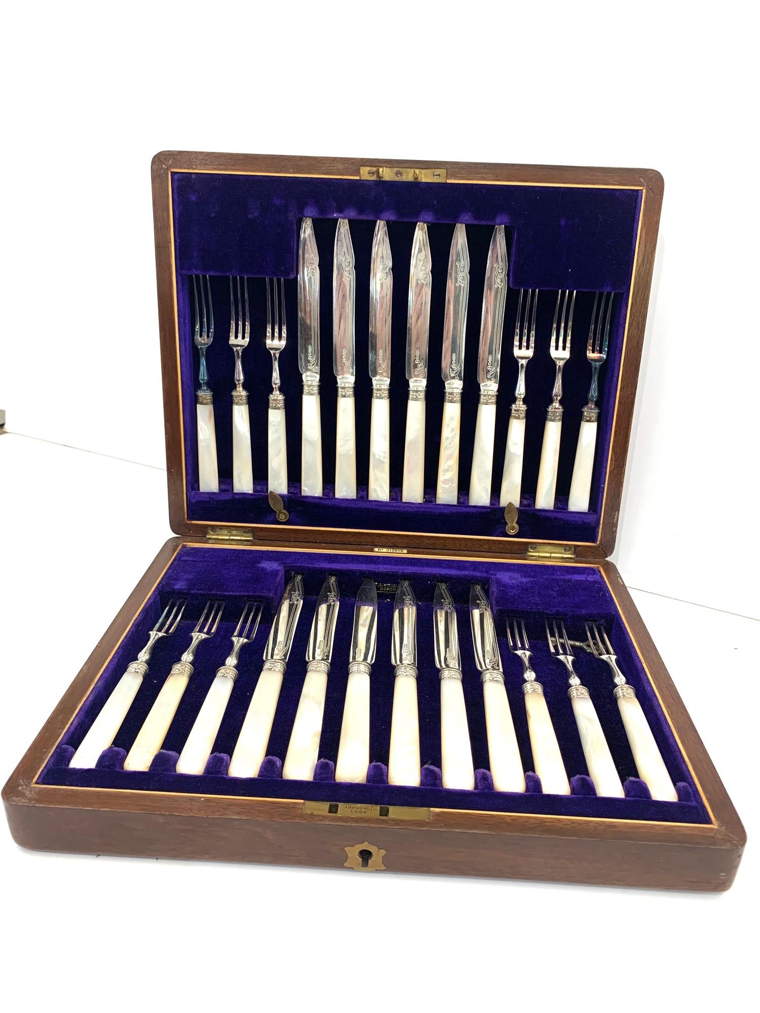 Boxed antique mother of pearl handle 12 setting fish knives and forks in good original condition