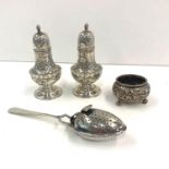 Silver cruet salts peppers and tea strainer