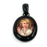 Antique jet picture locket pendant measures approx 6cm by 3.5cm widest points in good condition