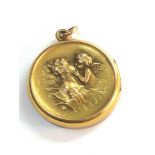 Art Nouveau gilt yellow metal angel locket diameter 2.5cm