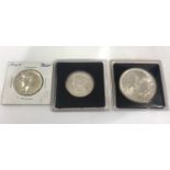 Silver liberty eagle and 2 silver half dollars