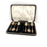 Boxed set of silver tea spoons and sugar tongues