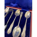 Boxed set of silver spoons and sugar tongues